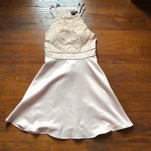 a creme colored dress with pockets. worn once.